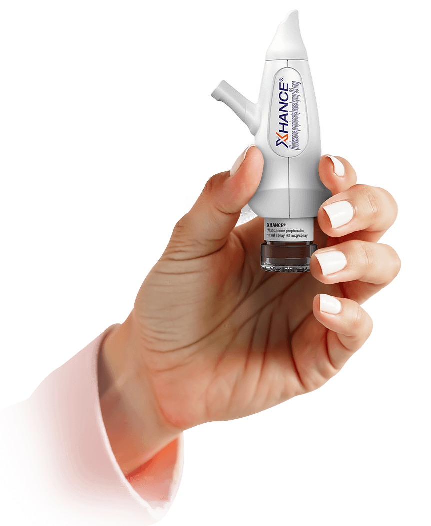 Hand holding the XHANCE nasal spray device prior to priming and administration